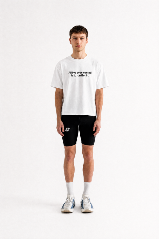 Runner wearing the white Salty Sports Club Berlin Tee, light cropped fit