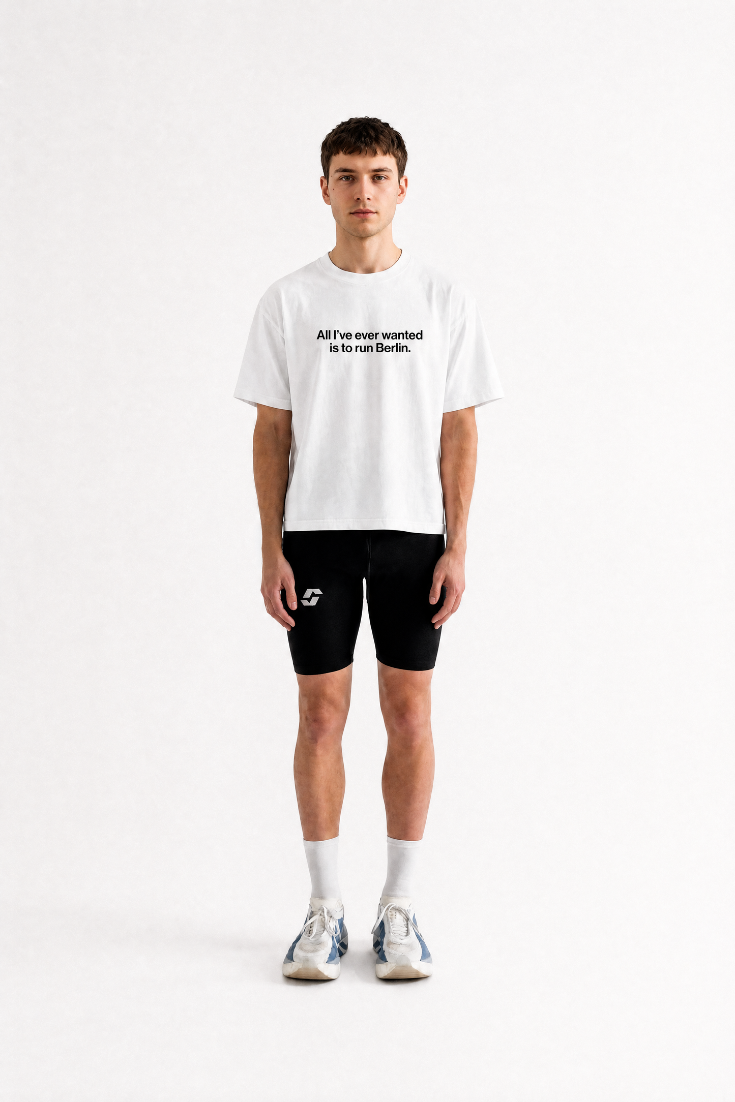 Runner wearing the white Salty Sports Club Berlin Tee, light cropped fit