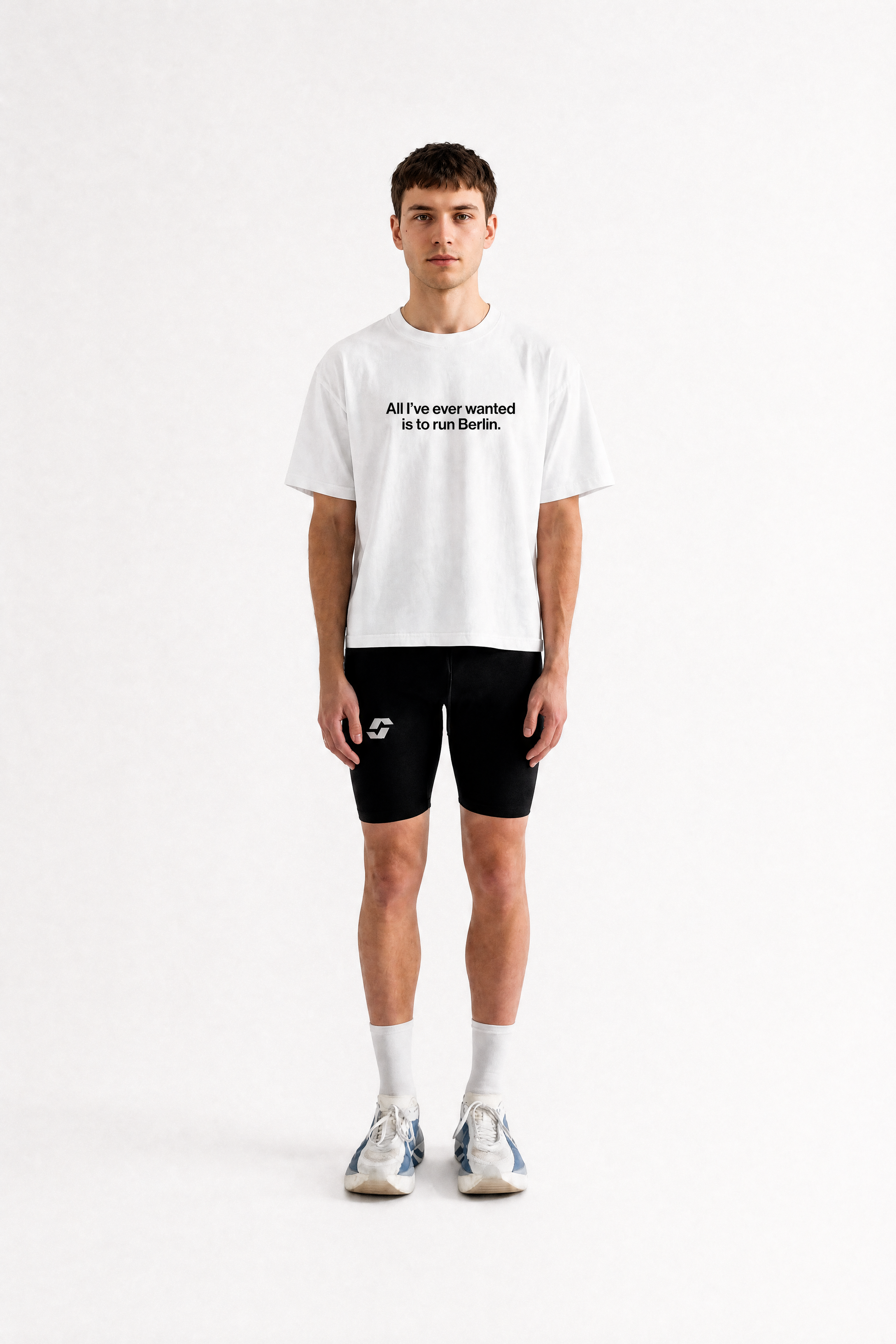 Runner wearing the white Salty Sports Club Berlin Tee, light cropped fit
